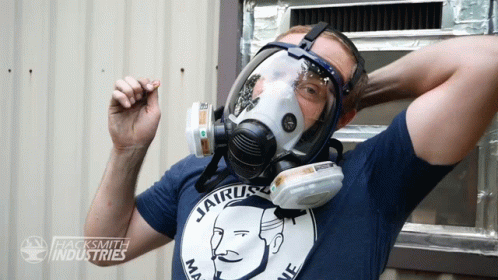 A Man Wearing A Gas Mask And A Shirt That Says Jairus GIF