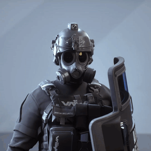 A Man Wearing A Gas Mask Is Holding A Shield That Says Arena Security On It GIF