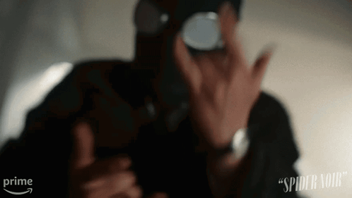 A Man Wearing A Gas Mask Is Taking A Picture Of Himself With A Prime Arrow Behind Him GIF