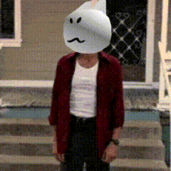A Man Wearing A Ghost Mask Is Standing On A Set Of Steps GIF