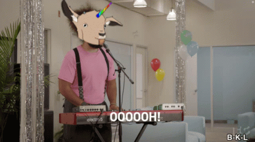a man wearing a goat mask is playing a keyboard that says ooooh on it