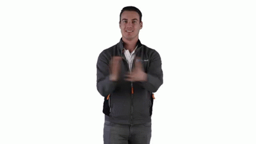 A Man Wearing A Gray Jacket Is Giving Two Thumbs Up . GIF