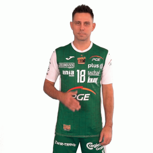A Man Wearing A Green And White Pge Shirt Holds His Hand To His Chest GIF
