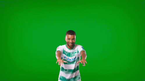a man wearing a green and white shirt that says holland