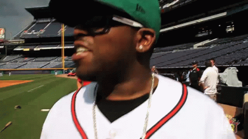 A Man Wearing A Green Hat That Says Lp On It GIF