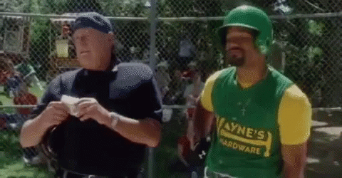 A Man Wearing A Green Helmet And A Yellow Shirt That Says Wayne 'S Hardware Is Talking To A Police Officer GIF