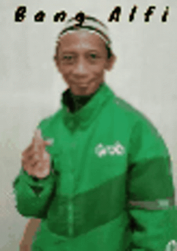 A Man Wearing A Green Jacket And A Hat Is Giving A Thumbs Up . GIF