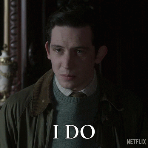 A Man Wearing A Green Jacket And A Sweater Says I Do GIF