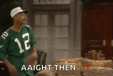 A Man Wearing A Green Jersey With The Number 12 On It Is Standing In Front Of A Table . GIF