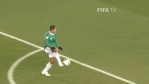A Man Wearing A Green Jersey With The Number 14 On It GIF
