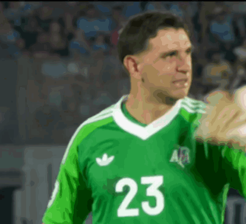 A Man Wearing A Green Jersey With The Number 23 GIF