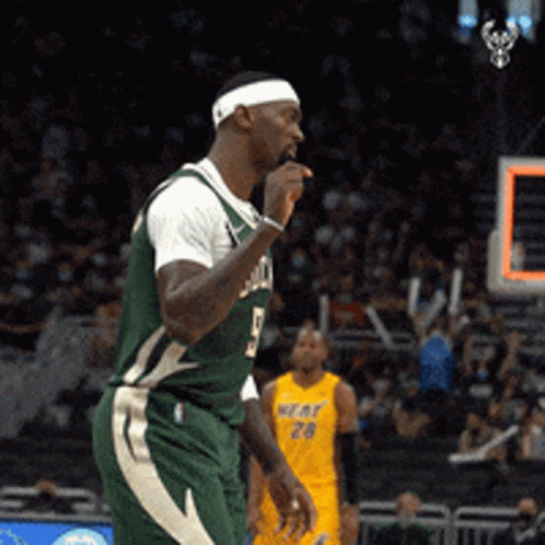 A Man Wearing A Green Jersey With The Number 5 On It GIF