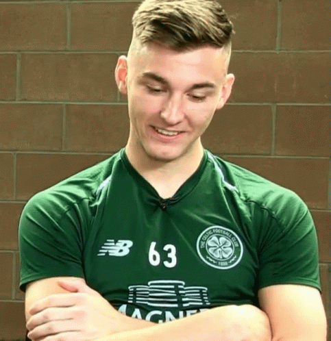 A Man Wearing A Green Jersey With The Number 63 GIF