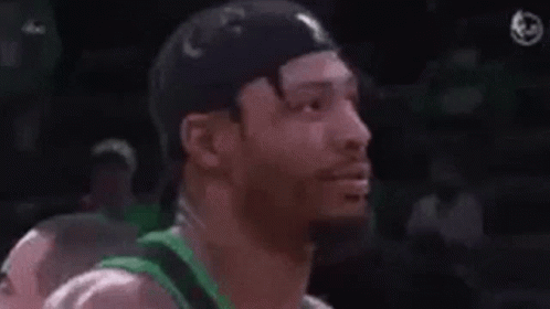 A Man Wearing A Green Jersey With The Words Fuck Marcus Smart GIF