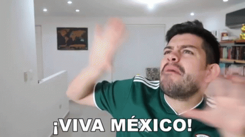 A Man Wearing A Green Jersey With The Words Viva Mexico On It GIF