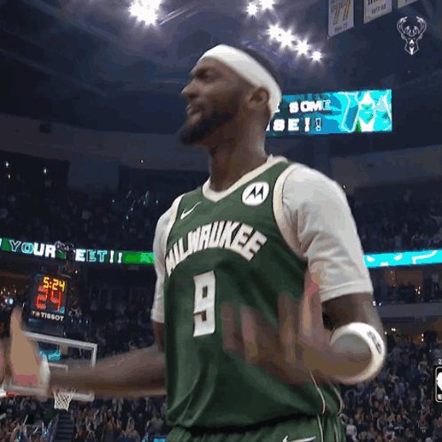 A Man Wearing A Green Milwaukee Jersey GIF