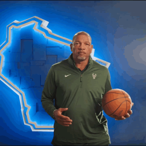 A Man Wearing A Green Nike Shirt Is Clapping GIF