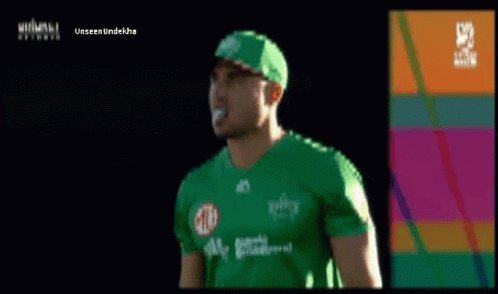 A Man Wearing A Green Shirt And A Green Hat With The Word Unseen Underneath GIF