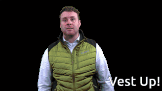 A Man Wearing A Green Vest With The Words Vest Up Behind Him GIF