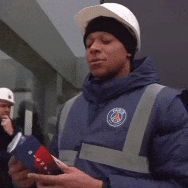 A Man Wearing A Hard Hat And A Blue Jacket That Says Psg On It GIF