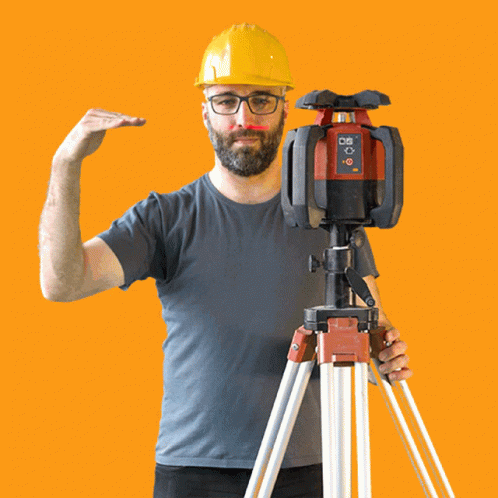 A Man Wearing A Hard Hat And Glasses Is Standing Next To A Red And Black Device That Says ' Bosch ' GIF