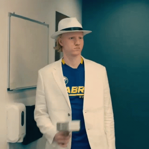 A Man Wearing A Hat And A Blue Shirt With Abr On It GIF