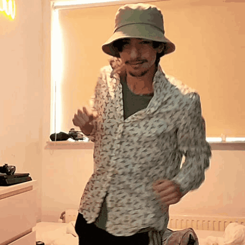 Man Dancing In Floral Shirt And Hat GIF