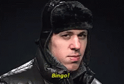 A Man Wearing A Hat And A Jacket Says Bingo ! GIF