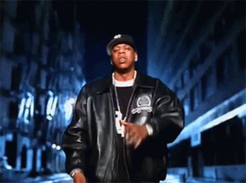 A Man Wearing A Hat And A Jacket With The Number 3 On The Front GIF