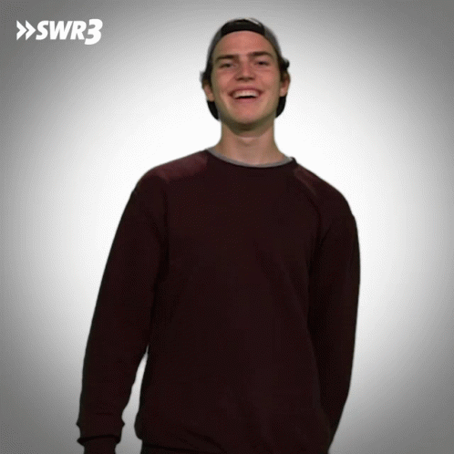A Man Wearing A Hat And A Maroon Sweater With Swr3 In The Corner GIF