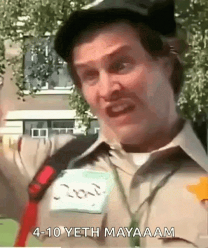 A Man Wearing A Hat And A Name Tag Is Making A Funny Face And Saying 4-10 Yeth Mayaam . GIF