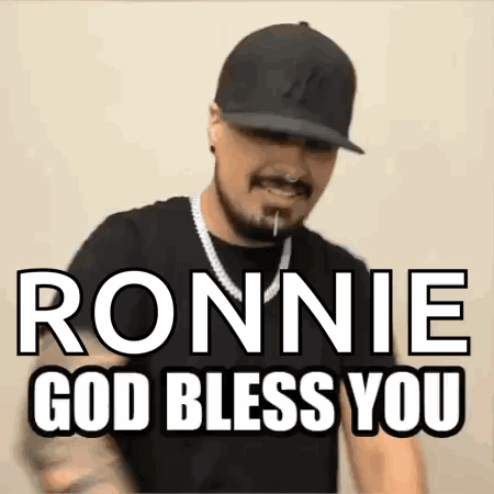 A Man Wearing A Hat And A Necklace Says Ronnie God Bless You . GIF
