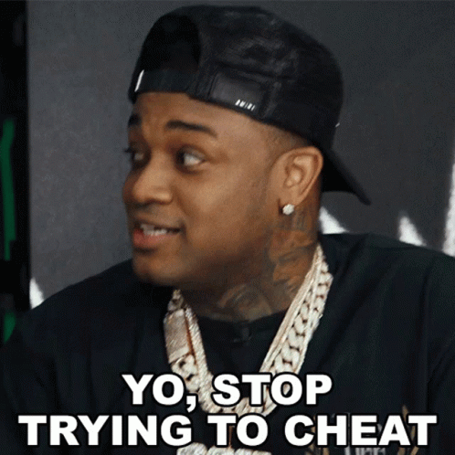 A Man Wearing A Hat And A Necklace Says Yo Stop Trying To Cheat GIF
