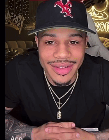 Man Wearing Hat And Cross Necklace GIF