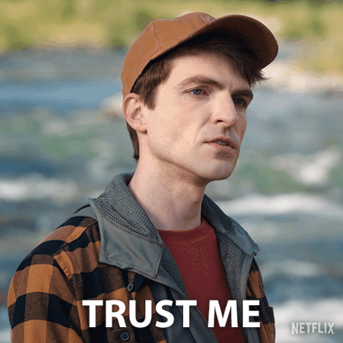 A Man Wearing A Hat And A Plaid Shirt Says Trust Me On A Netflix Poster GIF