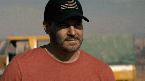 A Man Wearing A Hat And A Red Shirt GIF