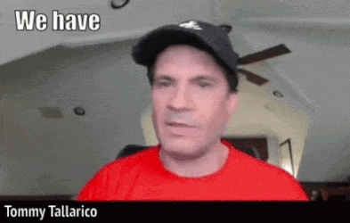 a man wearing a hat and a red shirt says " we have "