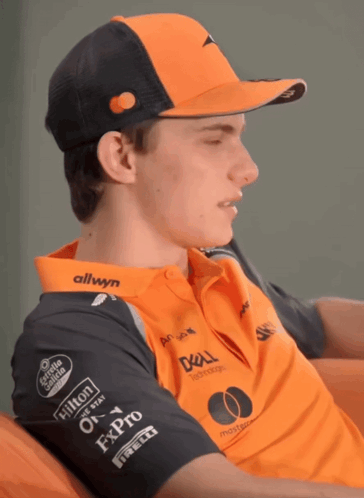 A Man Wearing A Hat And A Shirt That Says Allwyn On It GIF