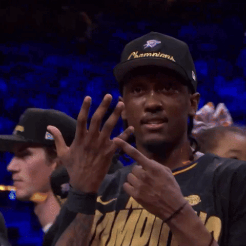 A Man Wearing A Hat And A Shirt That Says ' Champs ' On It GIF
