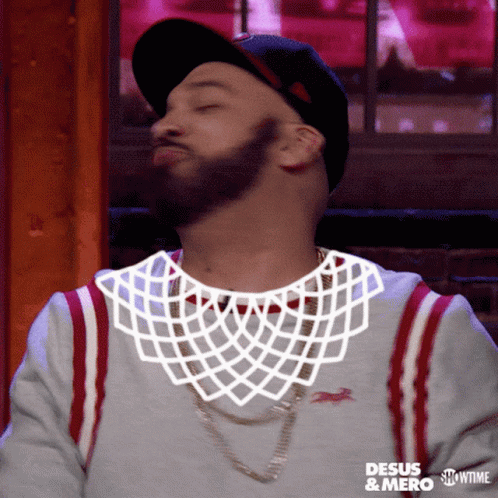 A Man Wearing A Hat And A Shirt That Says Desus & Mero GIF