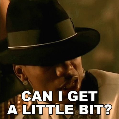 A Man Wearing A Hat And A Suit Is Asking Can I Get A Little Bit . GIF