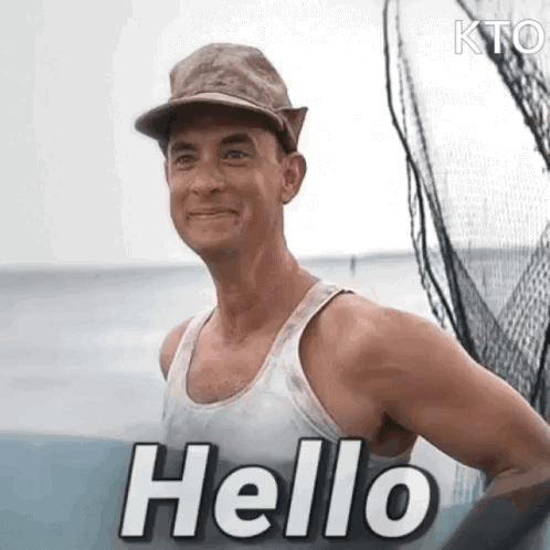 A Man Wearing A Hat And A Tank Top Is Standing On A Boat And Saying Hello . GIF
