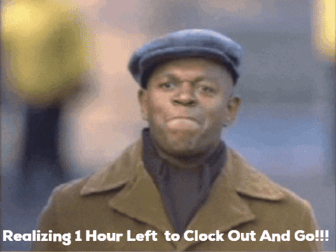 a man wearing a hat and a trench coat is realizing 1 hour left to clock out and go