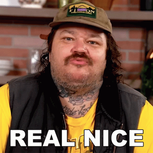 A Man Wearing A Hat And A Vest Says Real Nice GIF