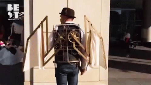 A Man Wearing A Hat And A Vest That Says Be Stz Products GIF