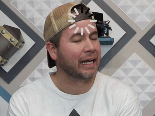 A Man Wearing A Hat And A White Shirt Has A Light Coming Out Of His Head GIF