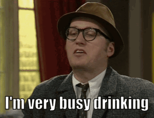 A Man Wearing A Hat And Glasses Is Saying I 'M Very Busy Drinking GIF