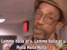 A Man Wearing A Hat And Glasses Is Saying Lemme Holla At U. GIF