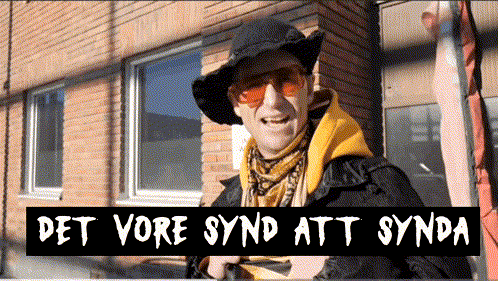 A Man Wearing A Hat And Sunglasses Is Standing In Front Of A Brick Building With The Words Det Vore Synd Att Synda Above GIF