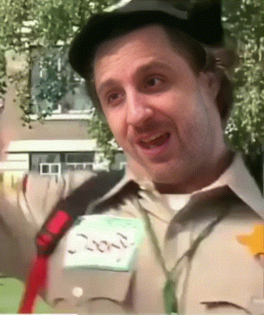 A Man Wearing A Hat And Tie Has A Name Tag That Says Jon GIF
